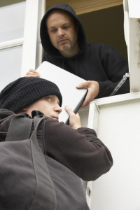 Men stealing laptop